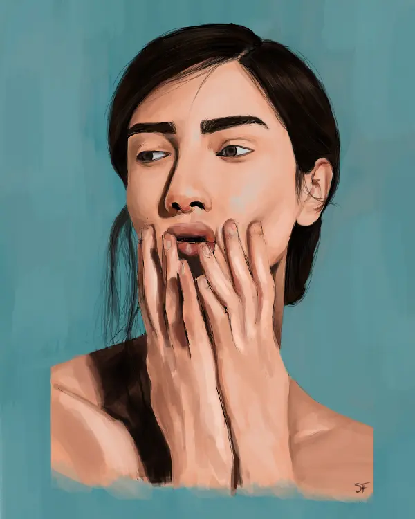 Portrait of woman touching her face